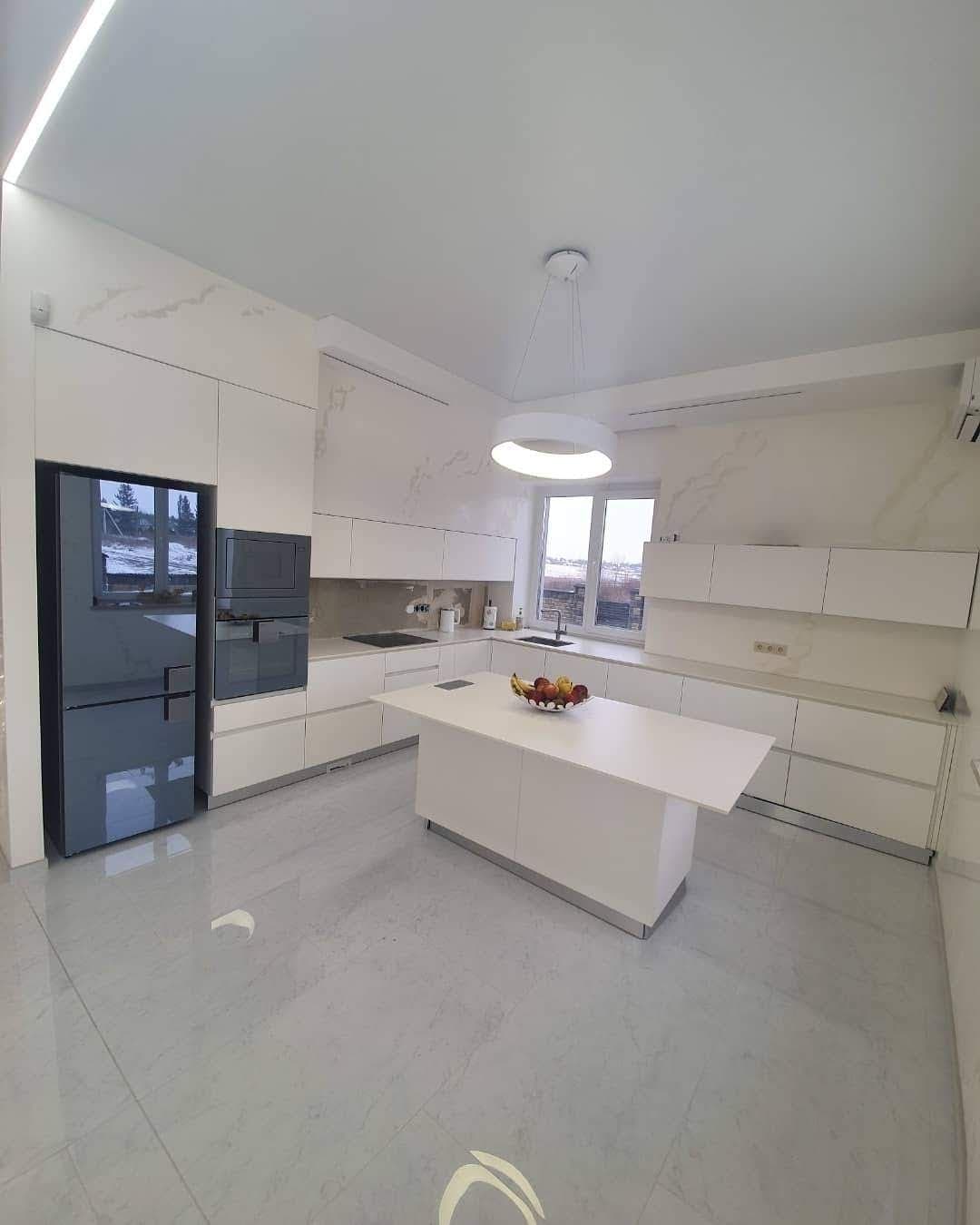 Minimalist white kitchen with island and marble floor, earlier work