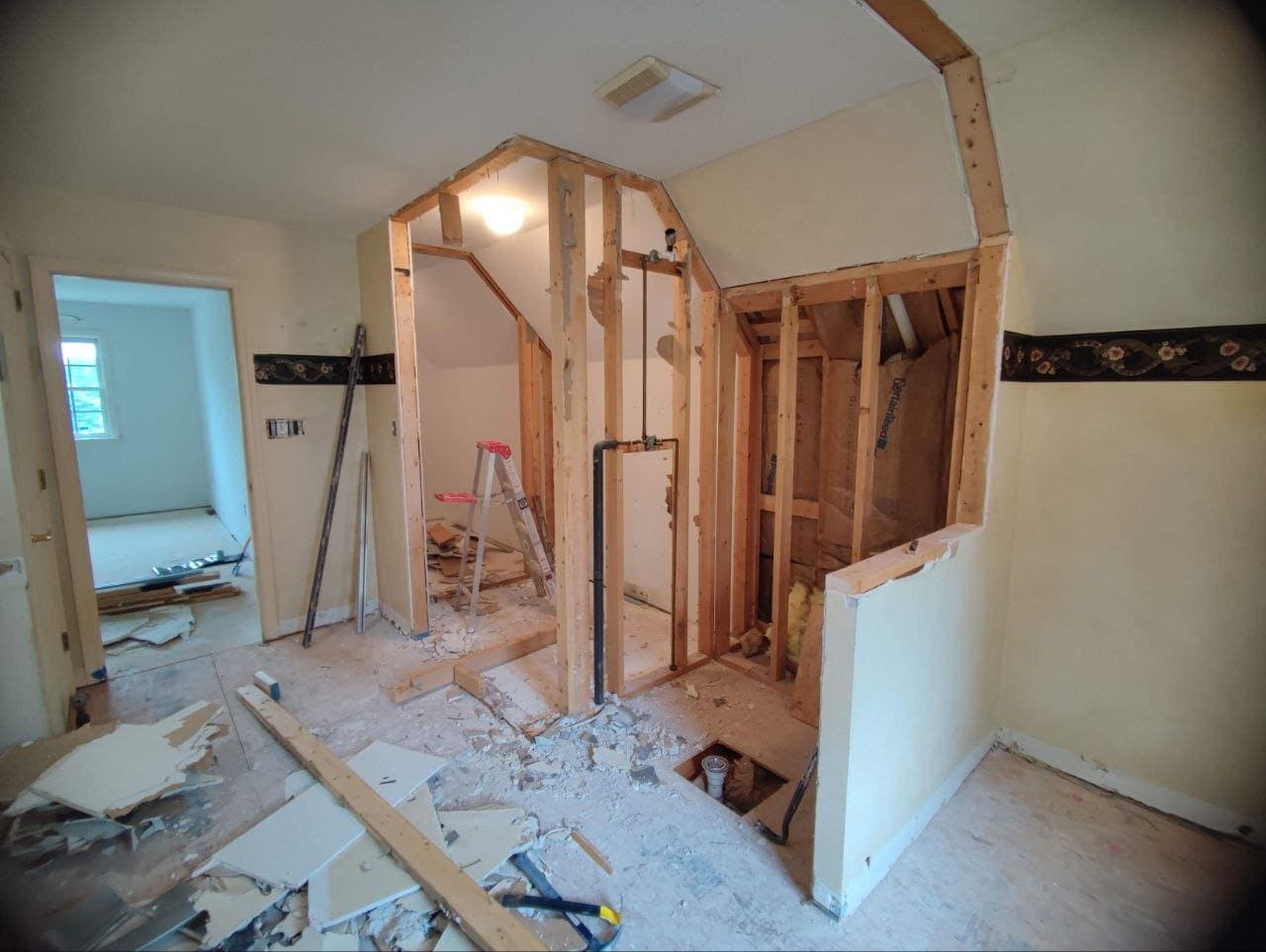 Bathroom demolition with stud walls opened before remodel
