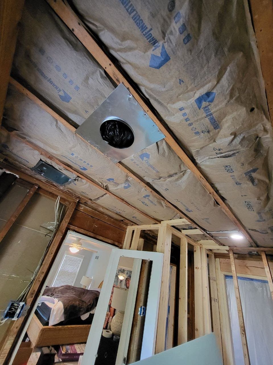 Ceiling insulation and new vent duct with wall framing