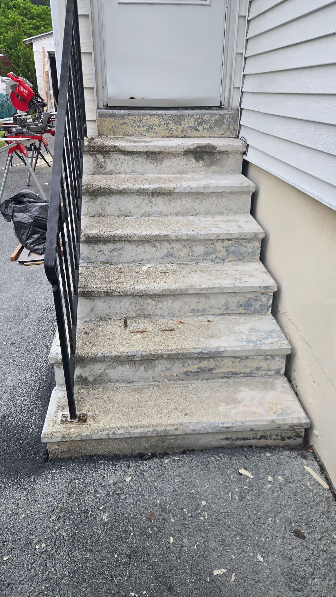 Worn concrete side steps before resurfacing