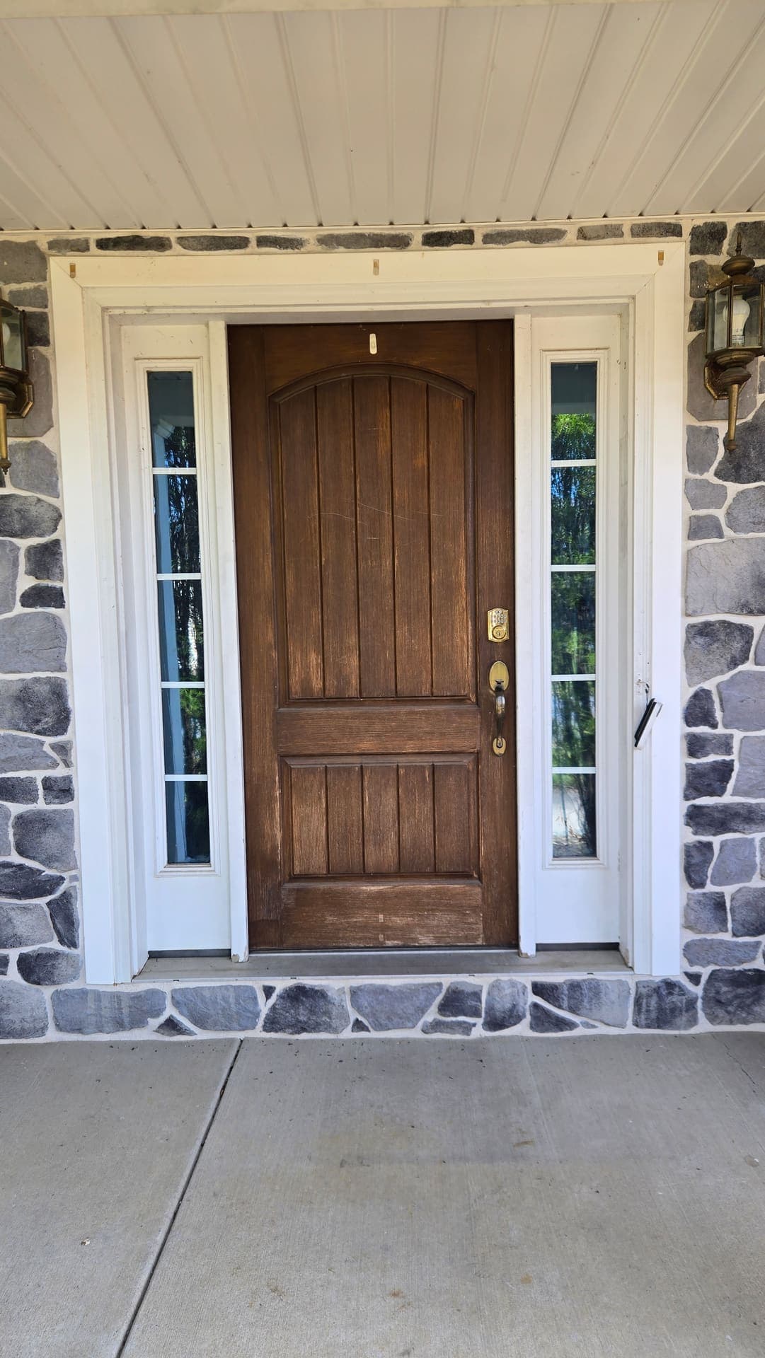 Worn wood front door before replacement