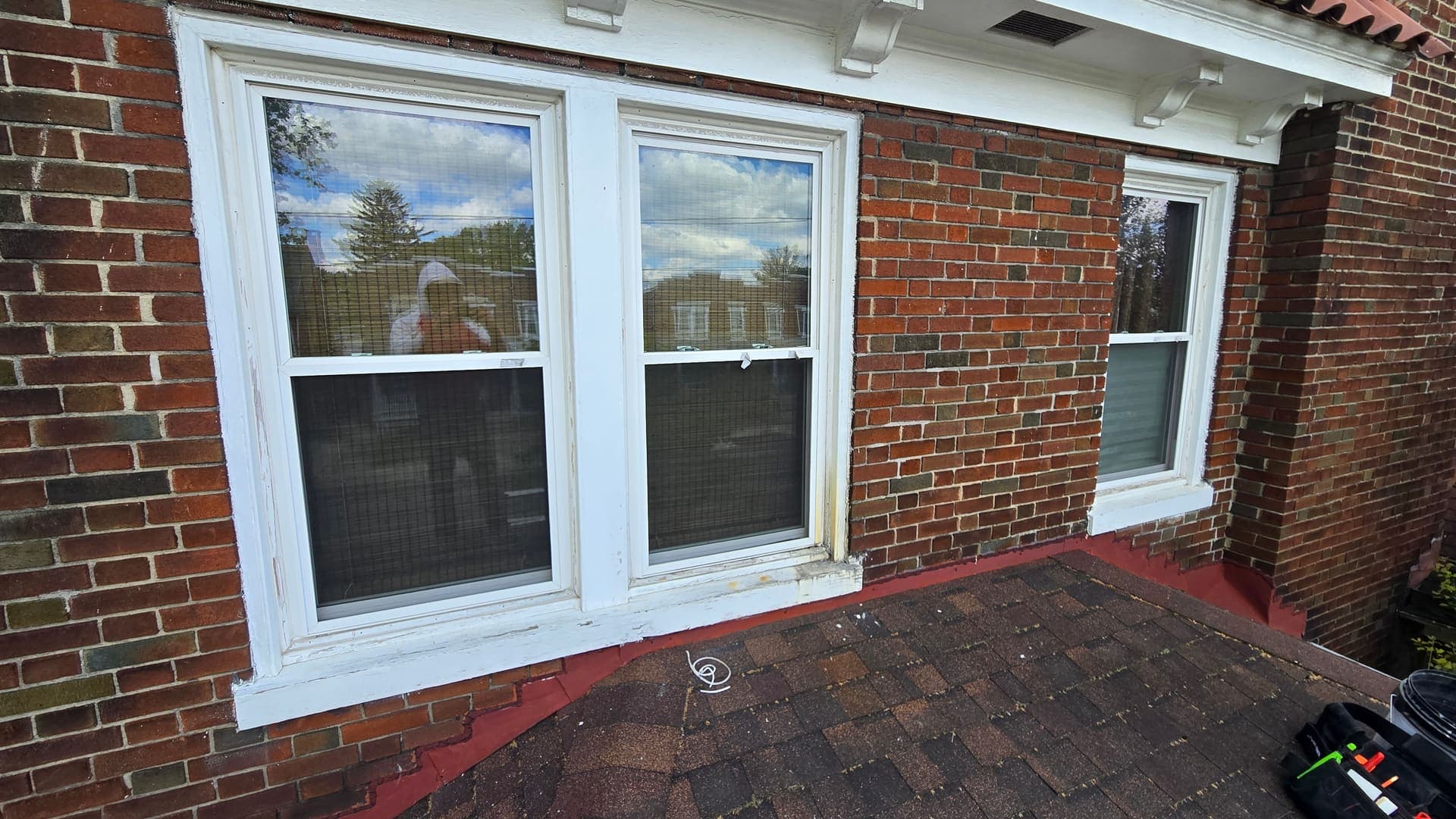 Two new double hung windows with fresh aluminum capping