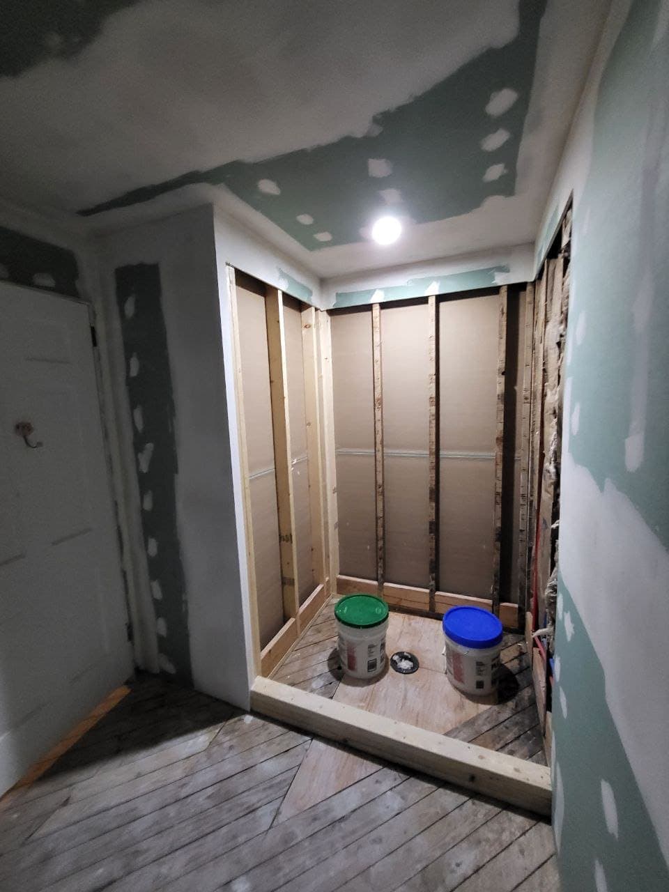 Framed shower alcove during a bathroom rebuild
