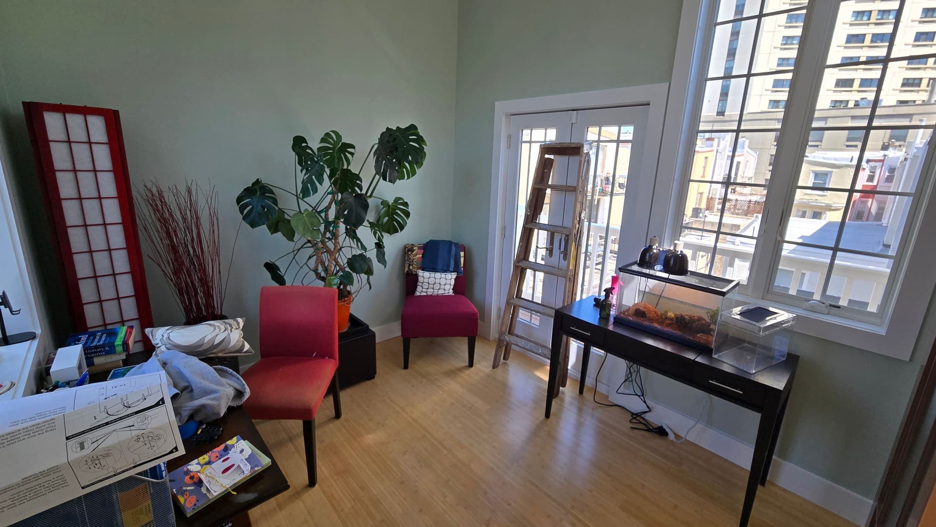 Sitting room before renovation with tall windows