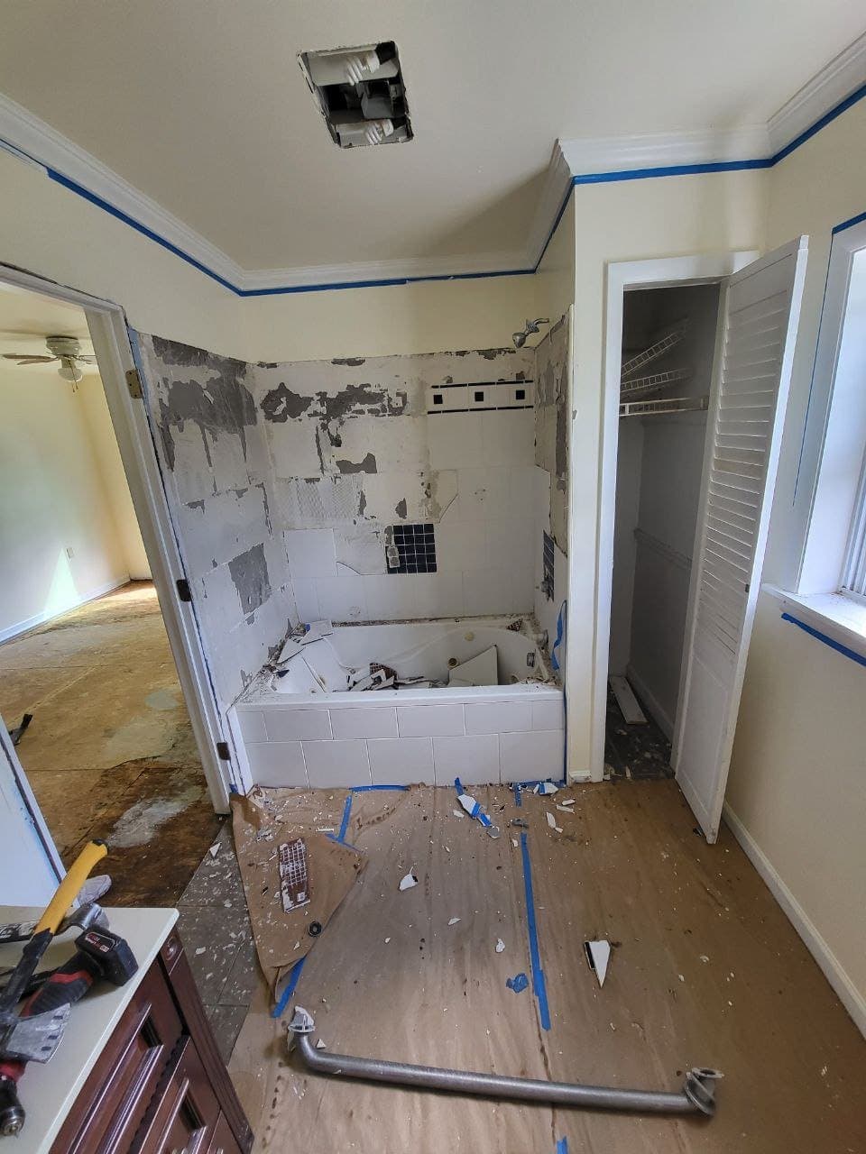 Tub surround demolition with stripped tile walls