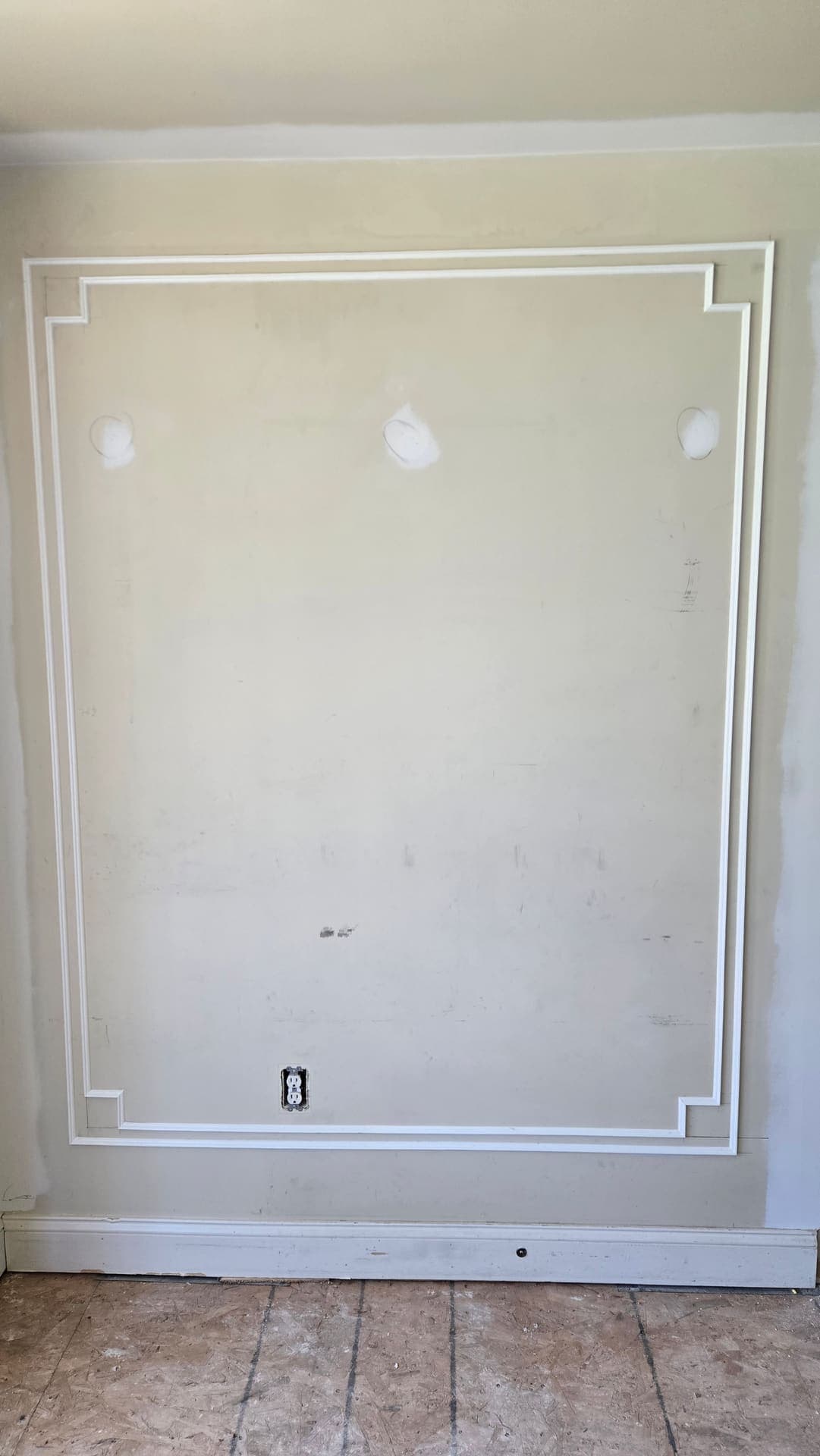 Picture frame wainscoting molding installed on a wall